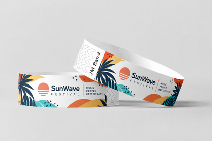 Twee papieren polsbandjes met full colour zonsondergang-festivalprint
