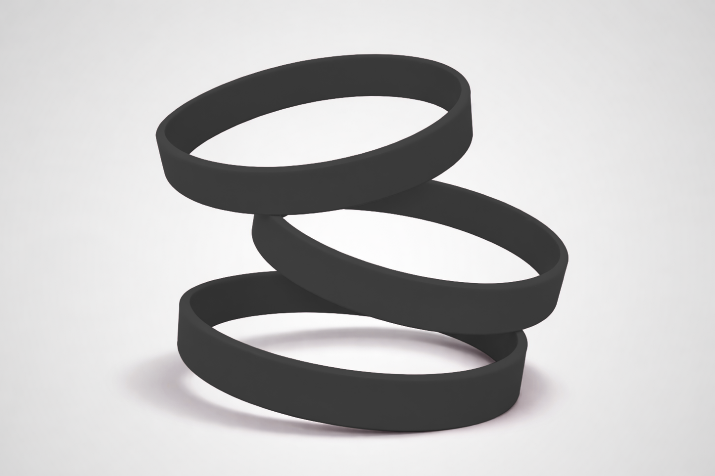 Zwarte, effen siliconen polsbandjes. Koop siliconen polsbandjes zonder opdruk bij JM Band®.