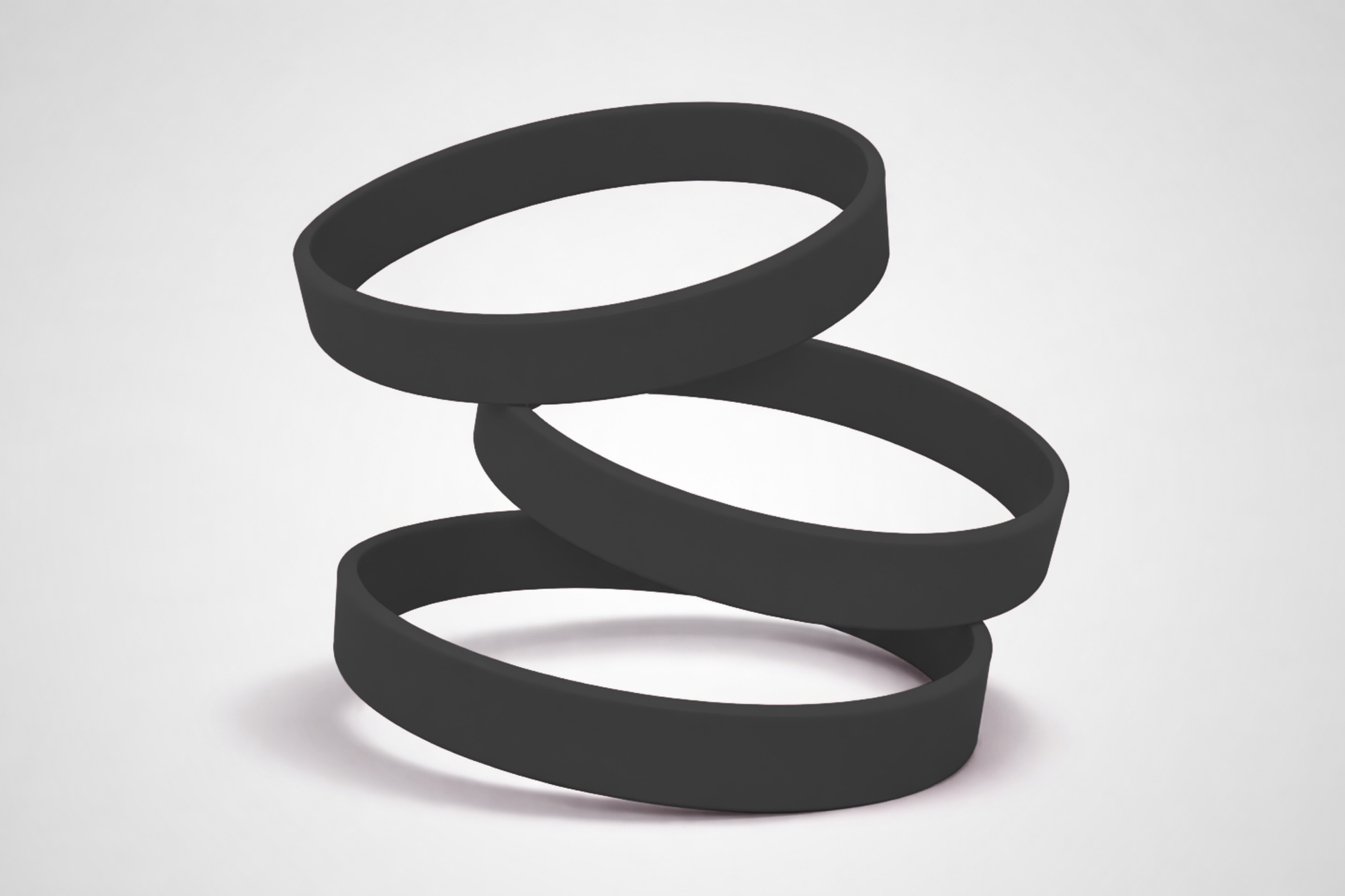 Zwarte, effen siliconen polsbandjes. Koop siliconen polsbandjes zonder opdruk bij JM Band®.