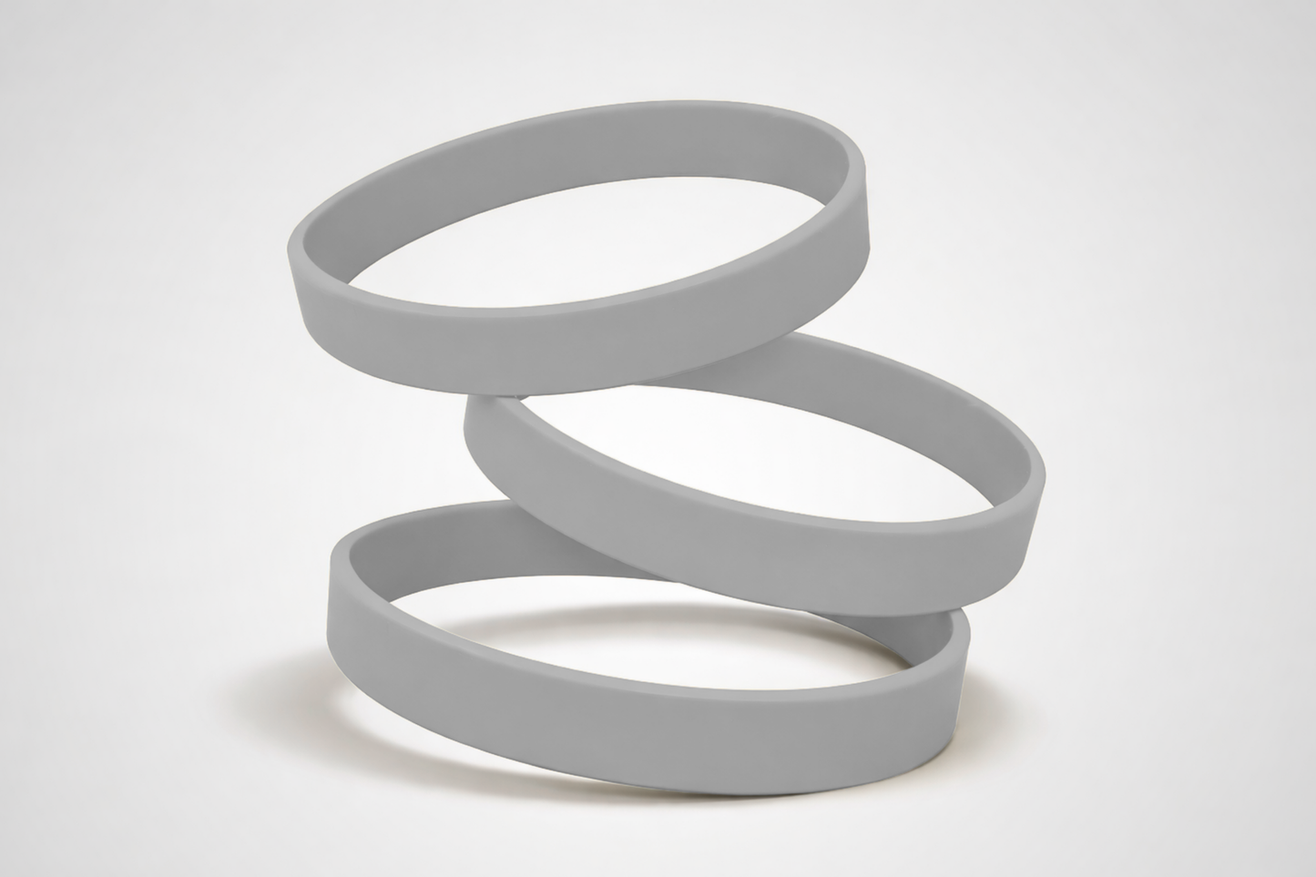 Grijze, effen siliconen polsbandjes. Koop siliconen polsbandjes zonder opdruk bij JM Band®.