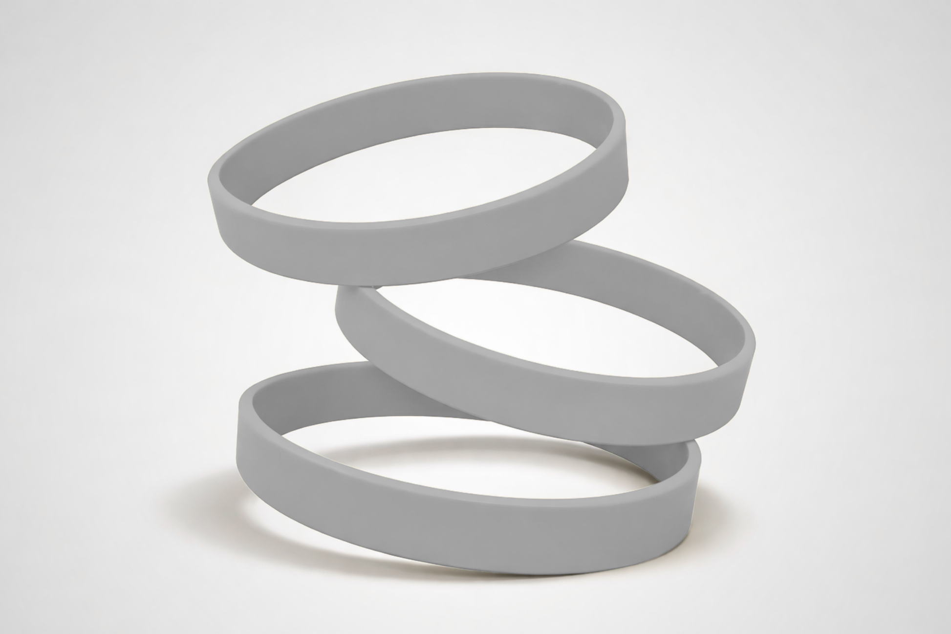 Grijze, effen siliconen polsbandjes. Koop siliconen polsbandjes zonder opdruk bij JM Band®.