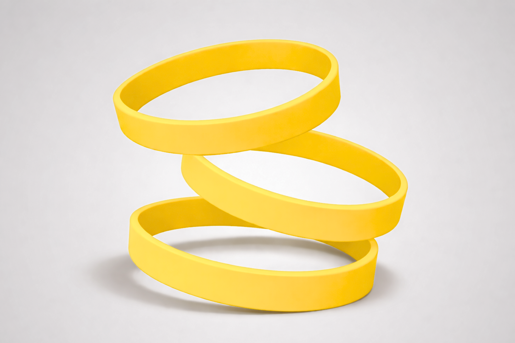 Gele, effen siliconen polsbandjes. Koop siliconen polsbandjes zonder opdruk bij JM Band®.